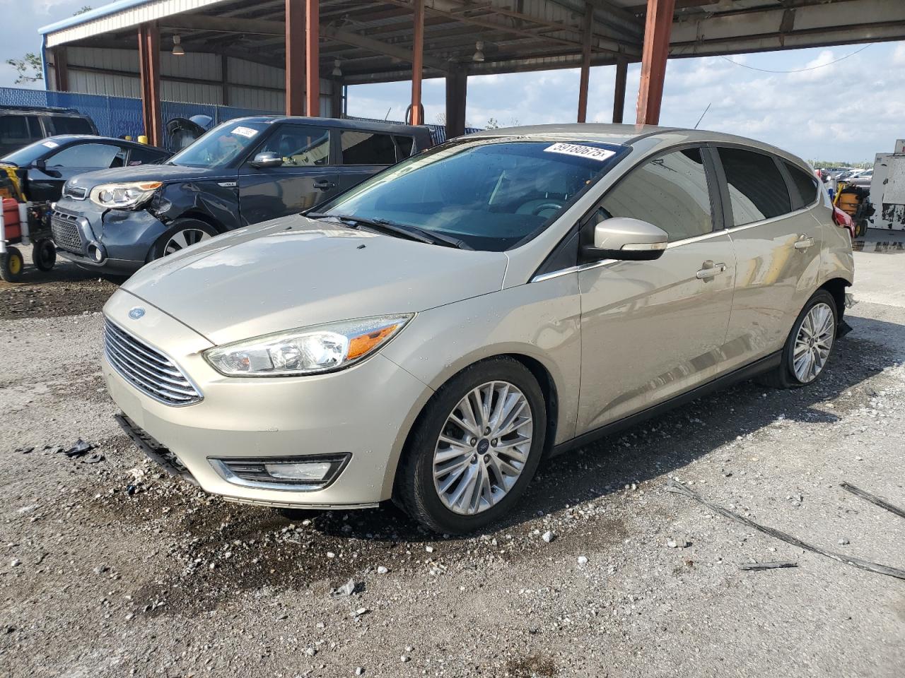 2016 Ford Focus Titanium, VIN 1FADP3N24GL302625 — Rear end
