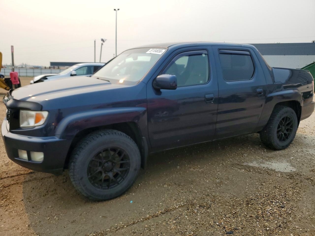 2010 Honda Ridgeline RTL, VIN 5FPYK1F56AB501751 — Rear end