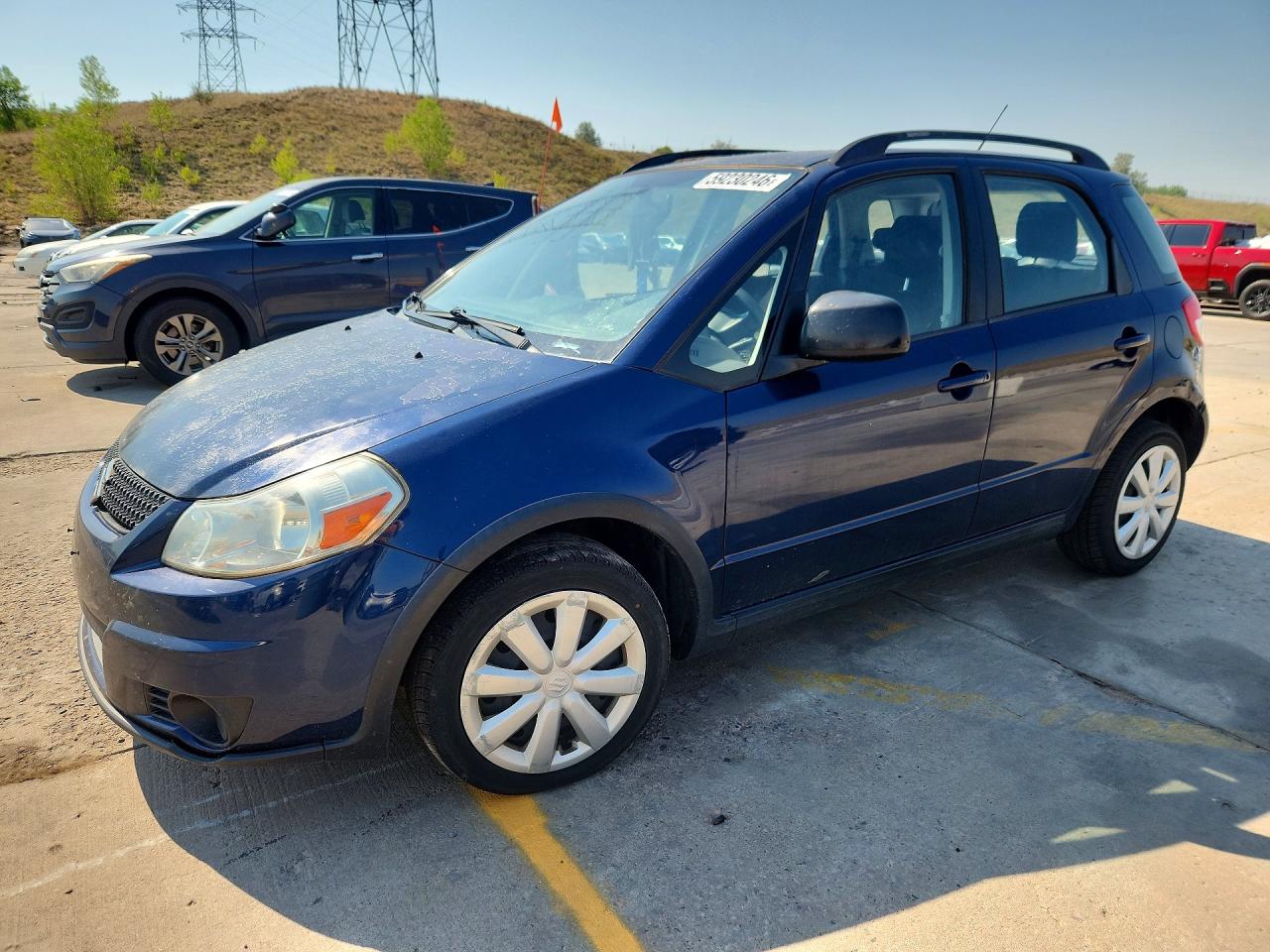 2011 Suzuki SX4 Crossover, VIN JS2YB5A30B6300954 — Side
