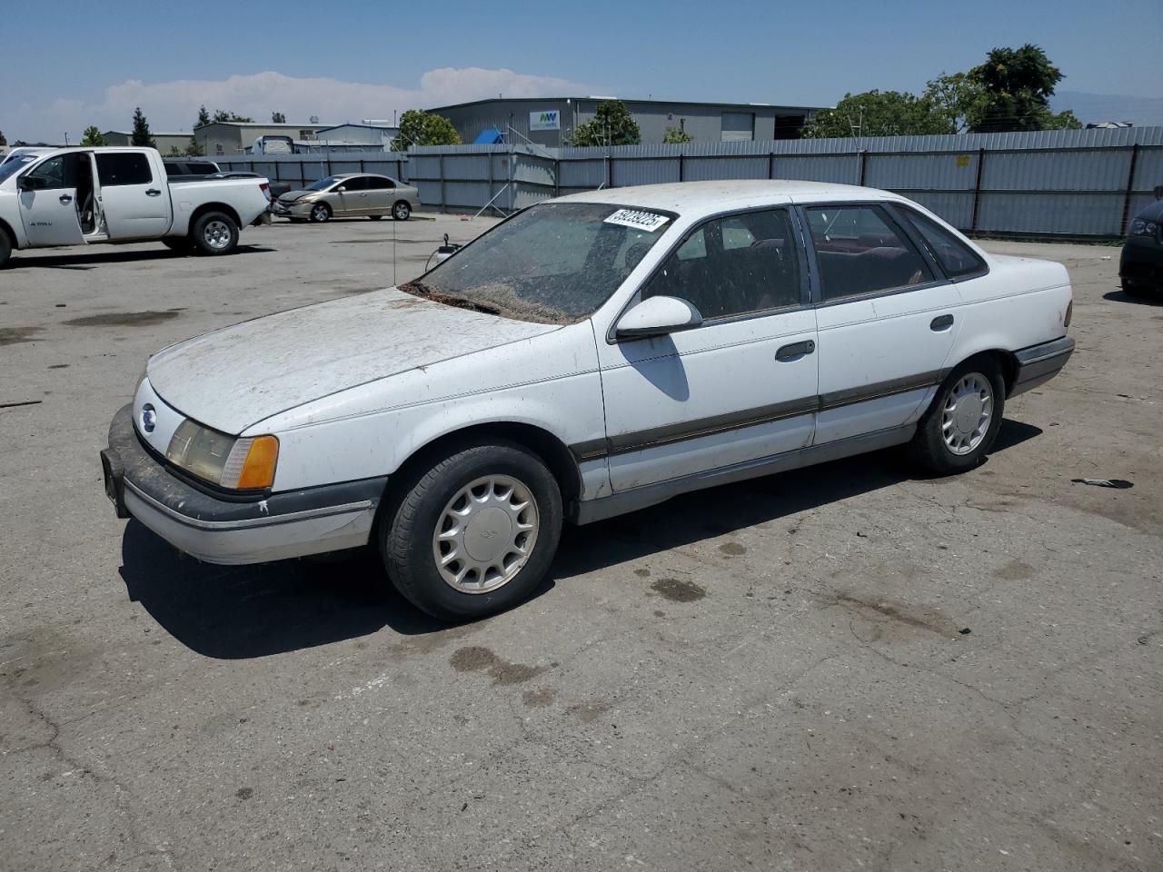 1989 Ford Taurus GL, VIN 1FABP52UXKG244224 — Normal wear