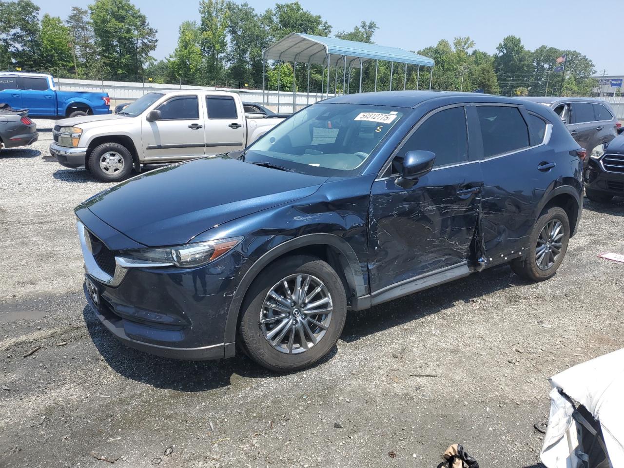2020 Mazda CX-5 Touring, VIN JM3KFBCM0L0815716 — Side