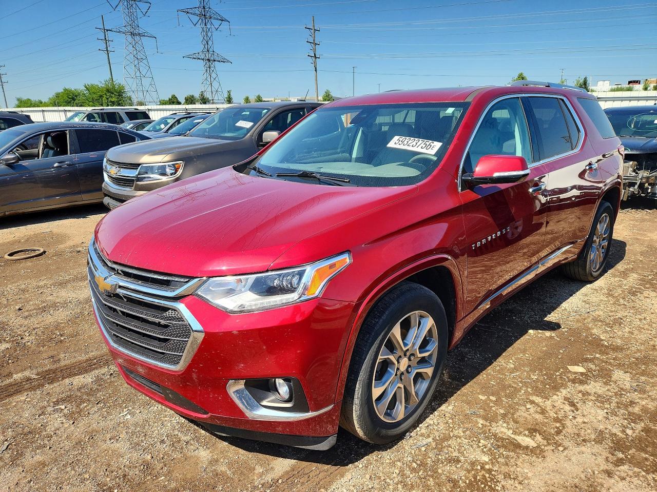2018 Chevrolet Traverse Premier, VIN 1GNEVJKW9JJ230413 — Side