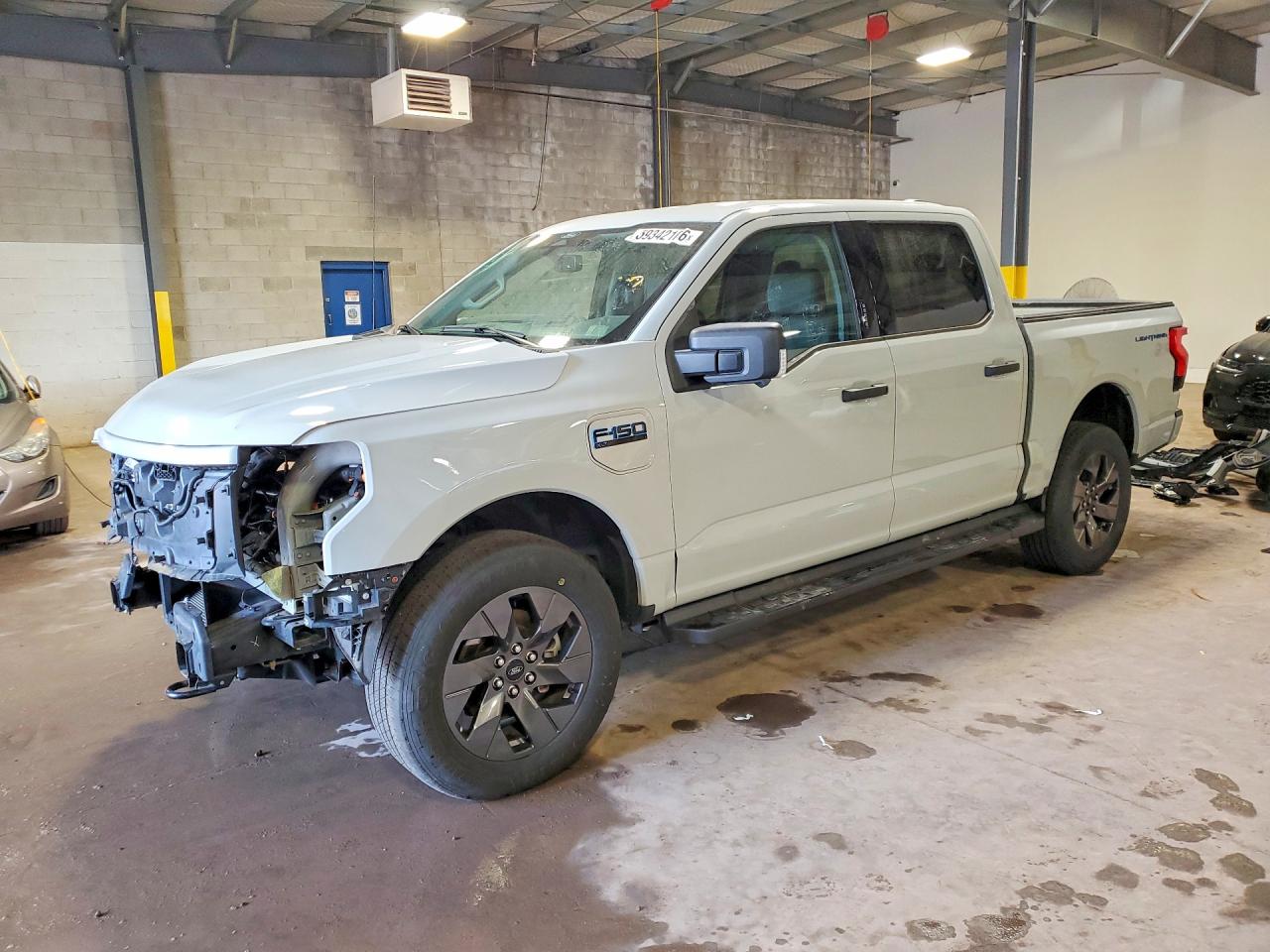2024 Ford F-150 Lightning XLT, VIN 1FTVW3LK0RWG27908 — Front end