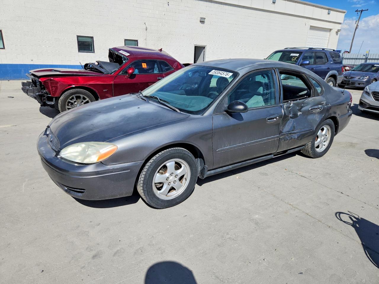 2005 Ford Taurus SE, VIN 1FAFP53UX5A235496 — Бок
