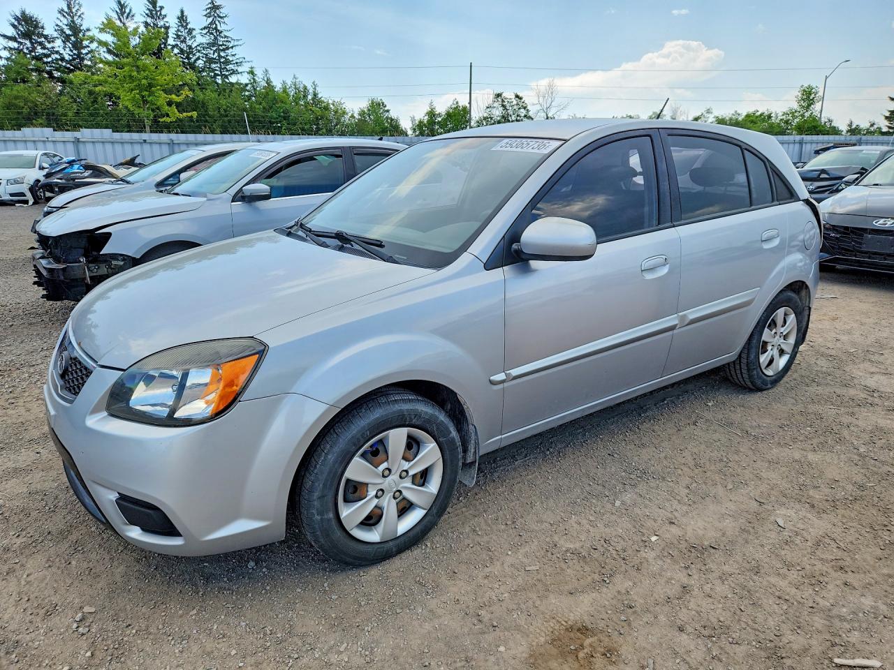 2011 Kia Rio, VIN KNADH5B34B6839452 — Зад