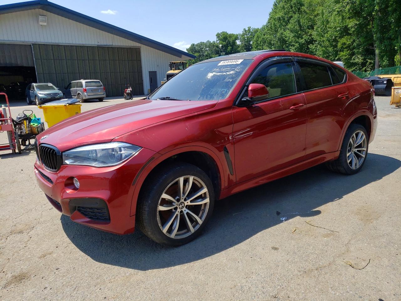 2018 BMW X6 xDrive35i, VIN 5UXKU2C54J0X49593 — Бок