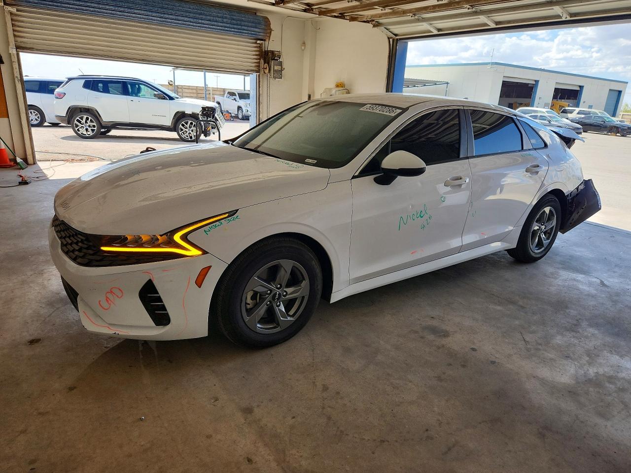 2023 Kia K5 LXS, VIN 5XXG14J23PG170462 — Hail