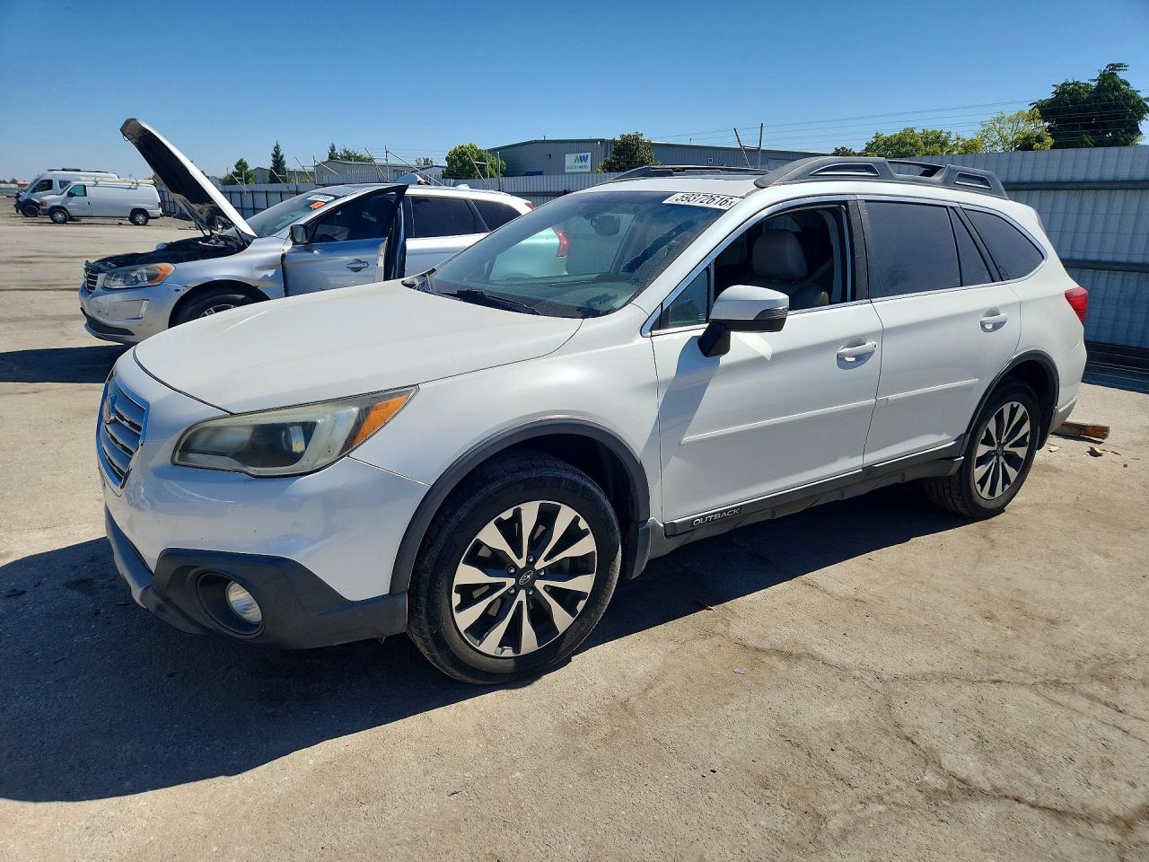 2015 Subaru Outback Limited, VIN 4S4BSENC7F3349503 — Side