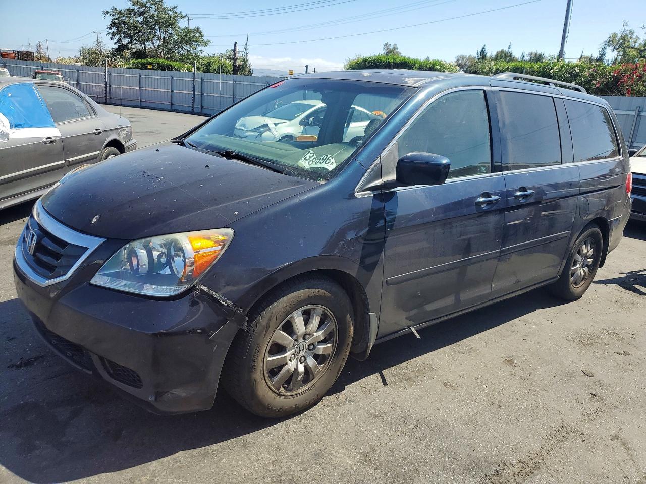2009 Honda Odyssey EX-L, VIN 5FNRL38779B408365 — Side
