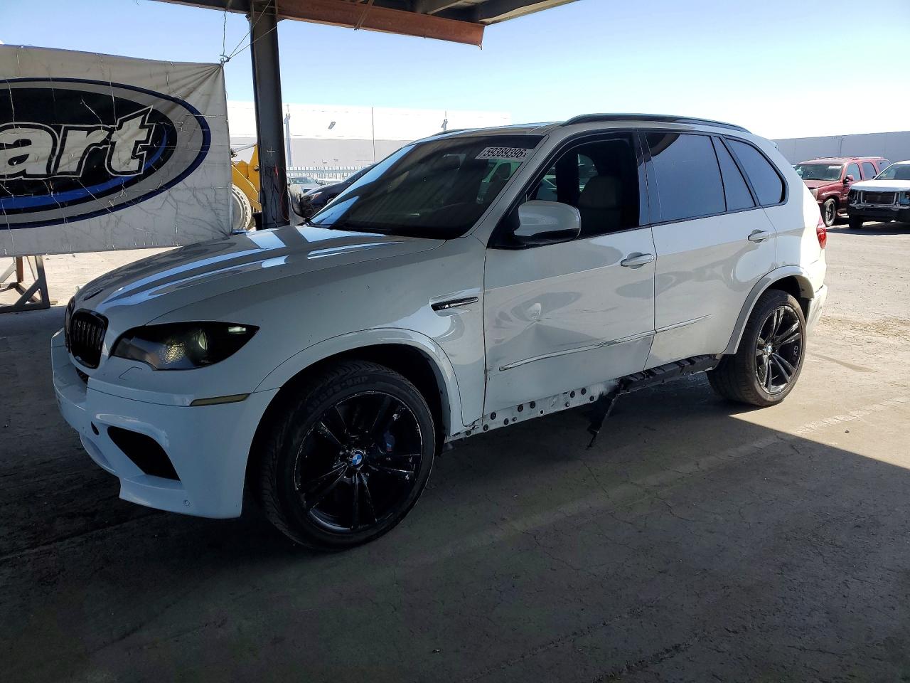 2011 BMW X5 M, VIN 5YMGY0C51BLK26927 — Side