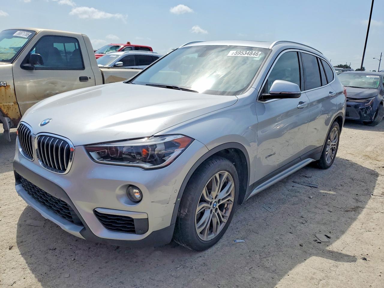 2016 BMW X1 xDrive28i, VIN WBXHT3Z30G4A50785 — Side
