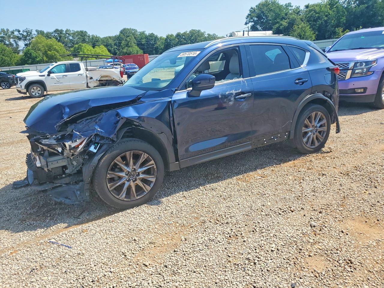 2021 Mazda CX-5 Grand Touring, VIN JM3KFADM2M1373459 — Front end