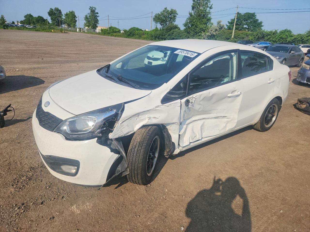 2013 Kia Rio LX, VIN KNADM4A31D6257304 — Side