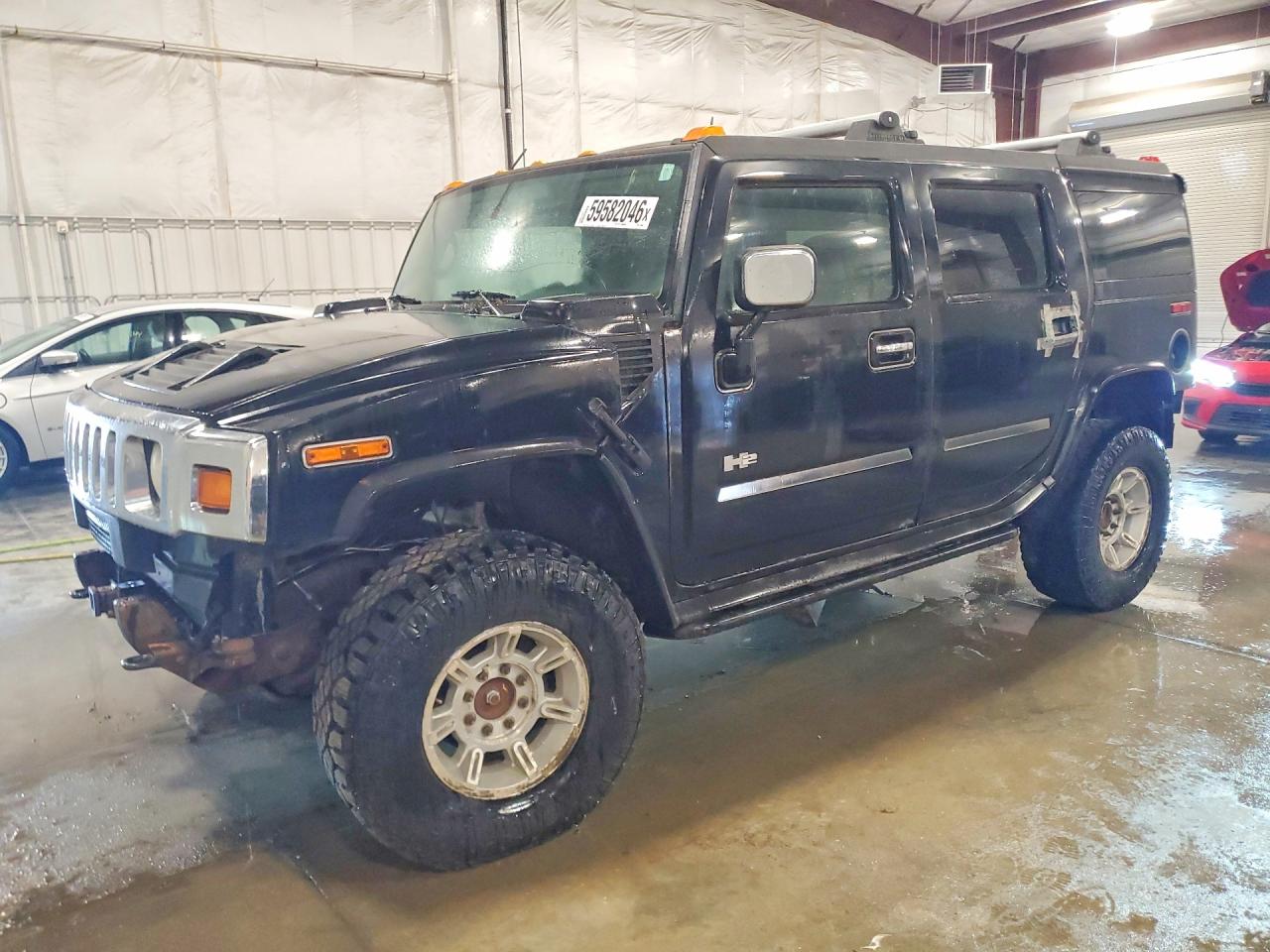 2003 Hummer H2, VIN 5GRGN23U83H113399 — Rear end