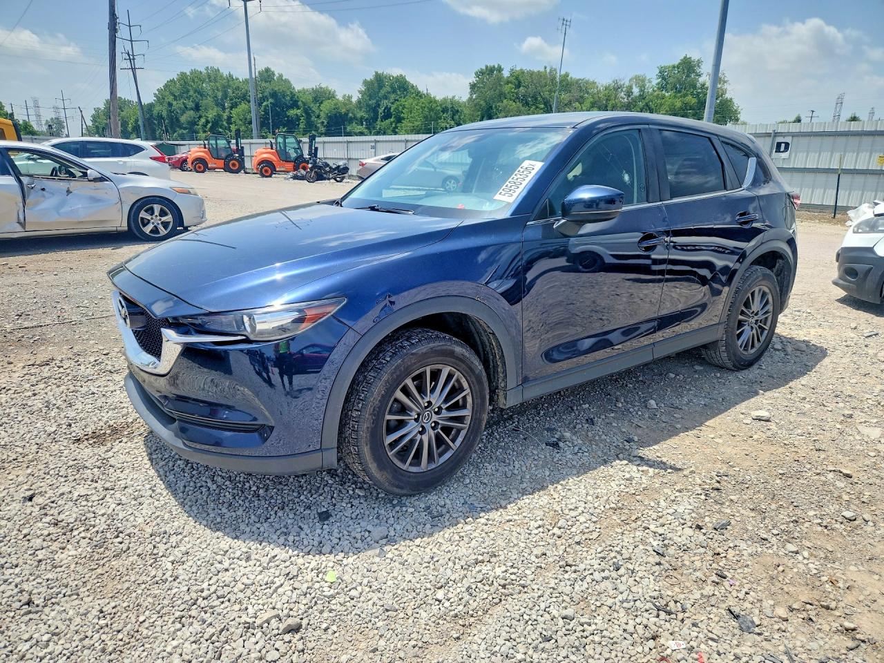 2018 Mazda CX-5 Touring, VIN JM3KFACM9J1365808 — Side