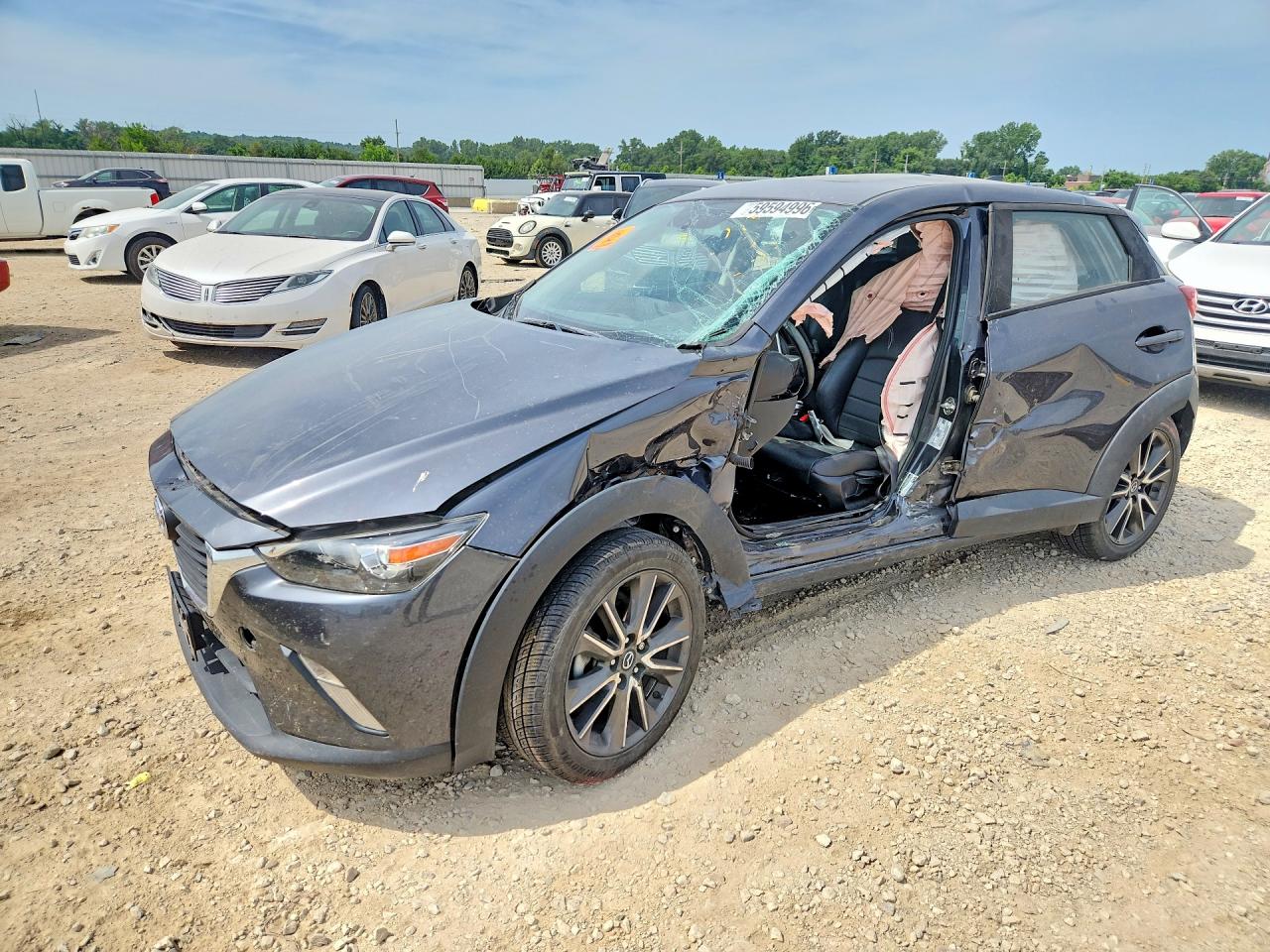 2017 Mazda CX-3 Touring, VIN JM1DKDC72H0166804 — Side