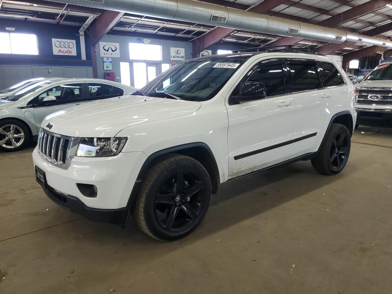 2013 Jeep Grand Cherokee Laredo, VIN 1C4RJFAG3DC557346 — Rear end