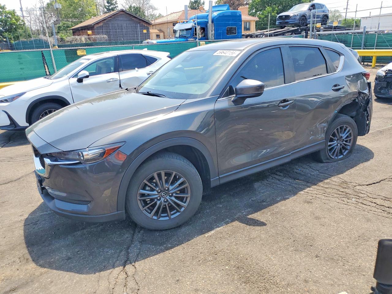 2021 Mazda CX-5 Touring, VIN JM3KFBCM0M0405970 — Side