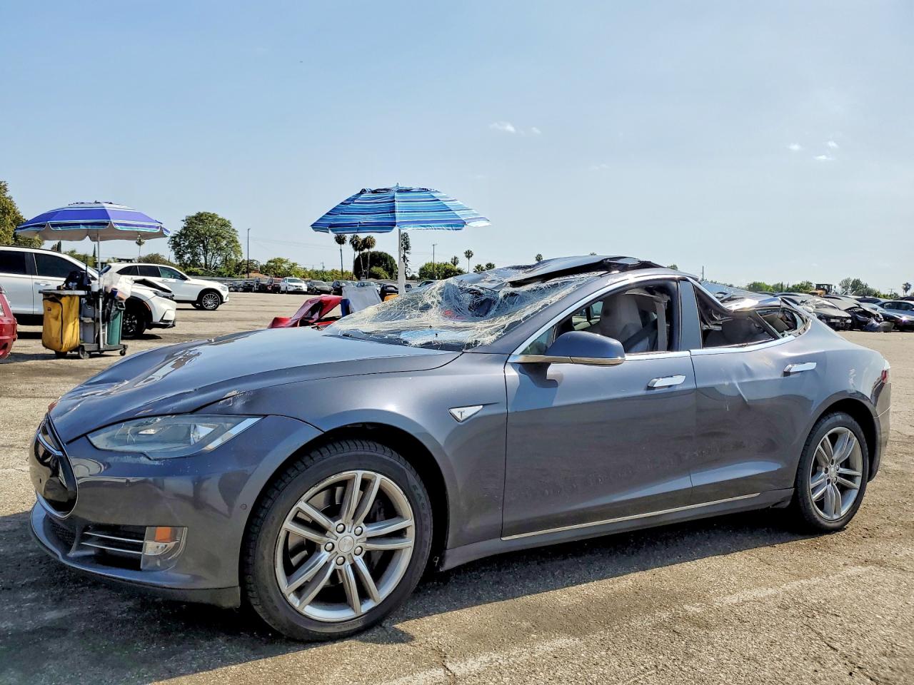 2015 Tesla Model S 85D, VIN 5YJSA1H24FF081774 — Rollover