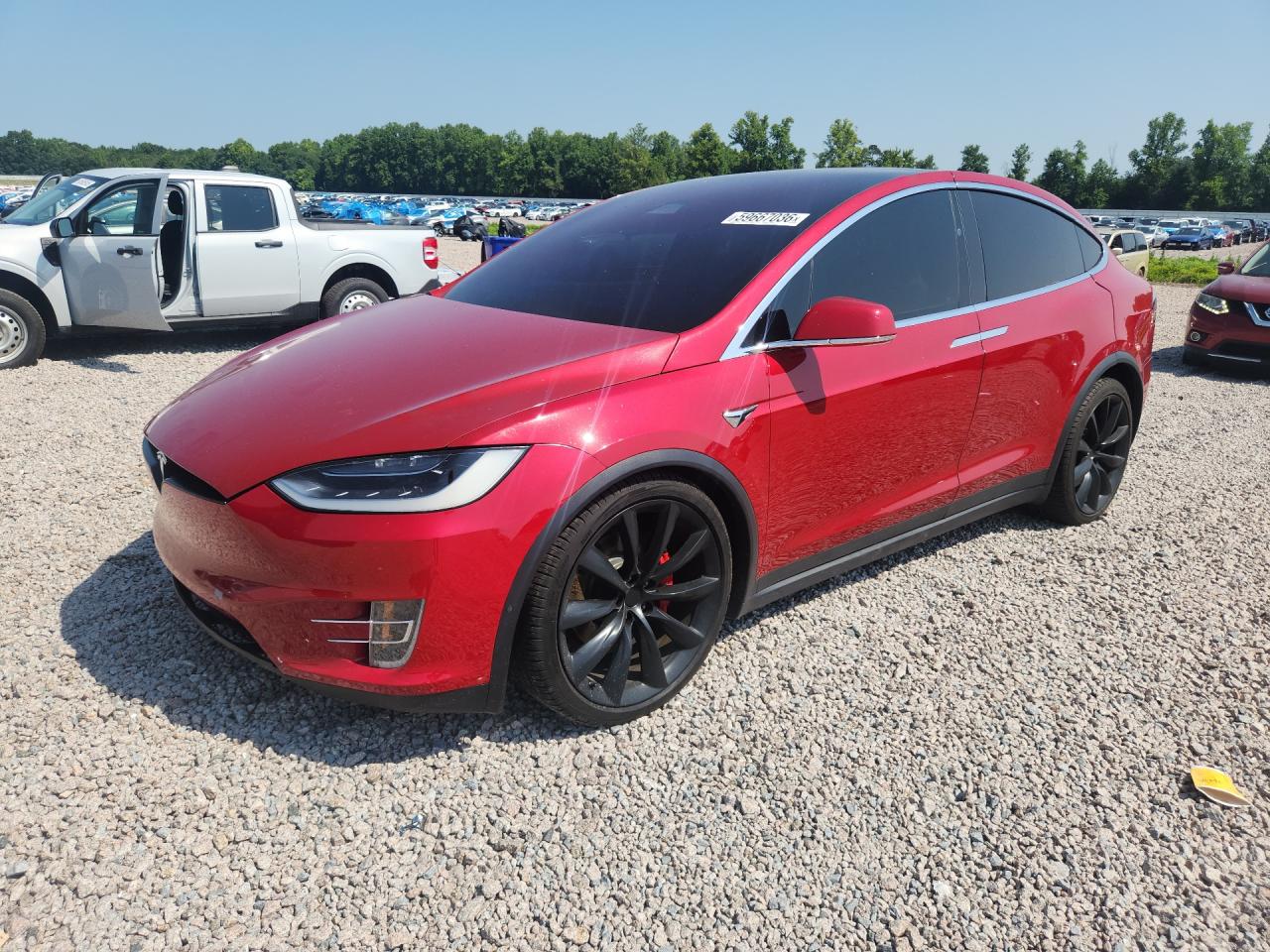 2017 Tesla Model X P100D, VIN 5YJXCBE48HF025027 — Side