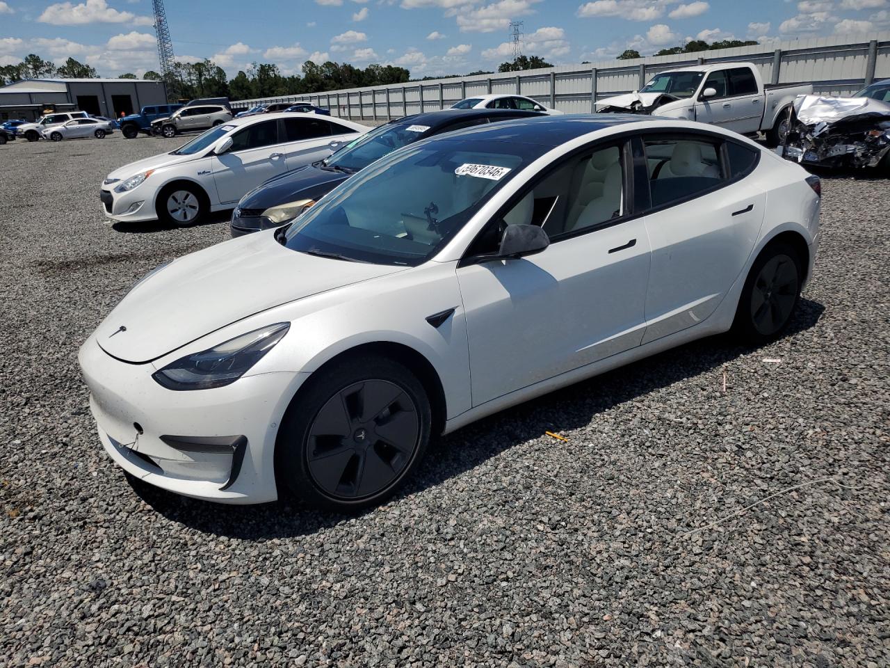 2021 Tesla Model 3 Standard Range Plus, VIN 5YJ3E1EA3MF088894 — Side