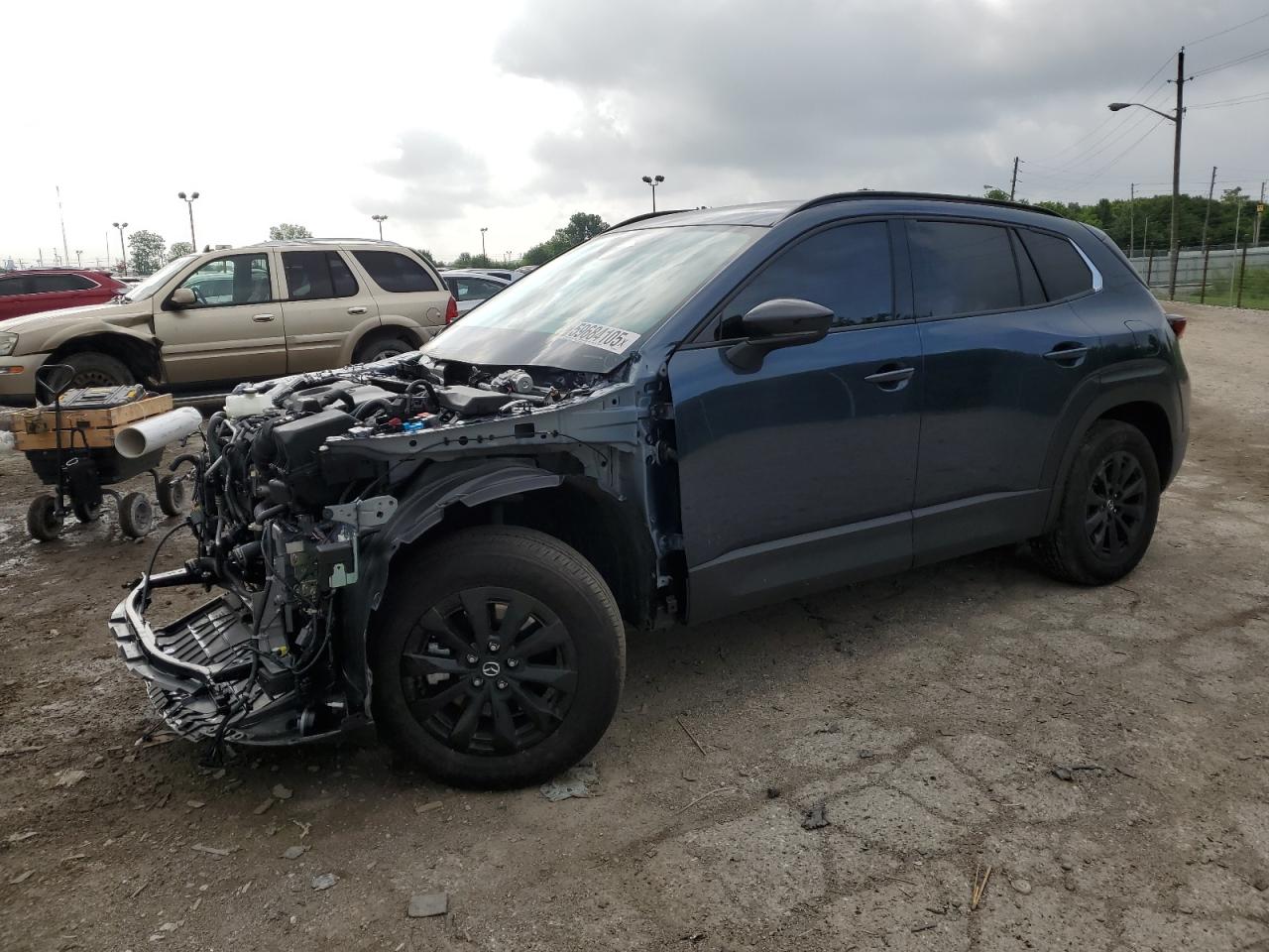 2025 Mazda CX-50 Hybrid Premium Package, VIN 7MMVAADWXSN105450 — Undercarriage