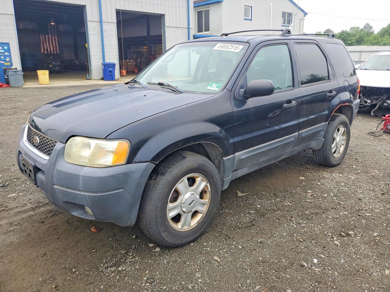 2003 Ford Escape XLT Popular 2, VIN 1FMYU93133KA02670 — Minor dents and scratches