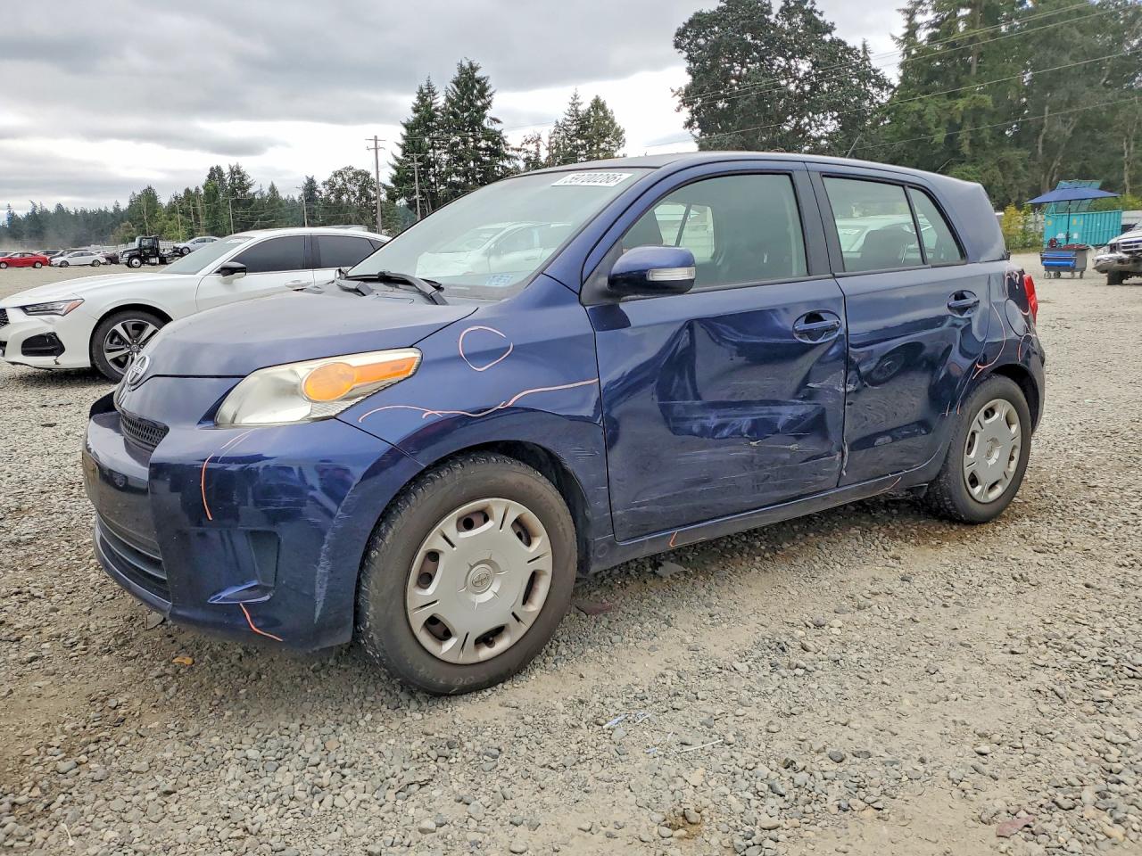 2010 Scion xD, VIN JTKKU4B48AJ053666 — Side