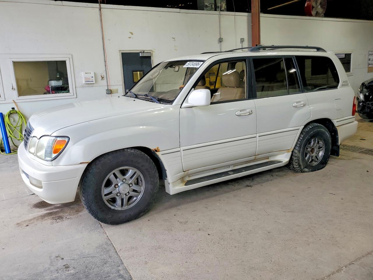 2002 Lexus LX 470, VIN JTJHT00W623522919 — Hail