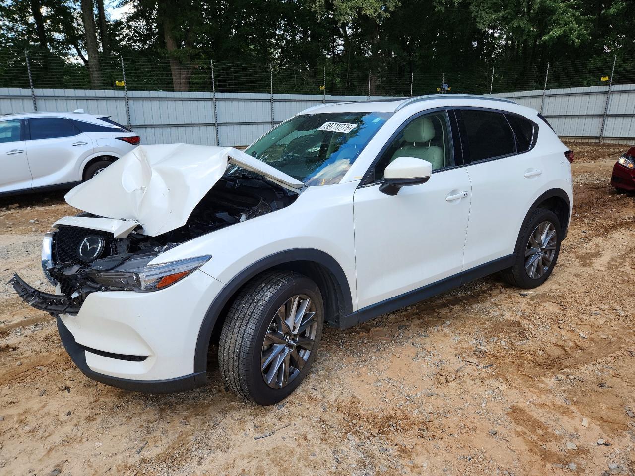 2021 Mazda CX-5 Grand Touring, VIN JM3KFADM9M0306637 — Front end