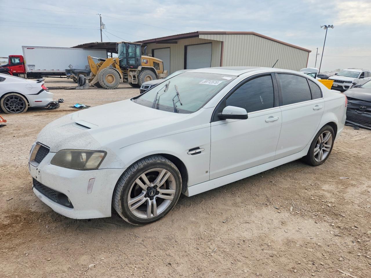 2009 Pontiac G8, VIN 6G2ER57789L167575 — Side