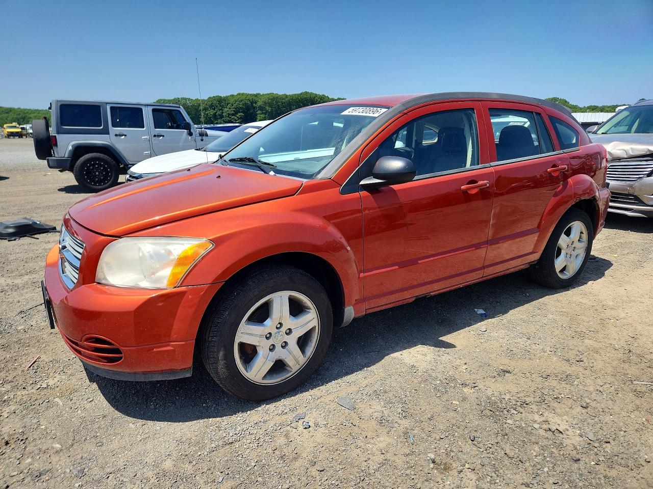 2009 Dodge Caliber SXT, VIN 1B3HB48A79D103926 — Бок