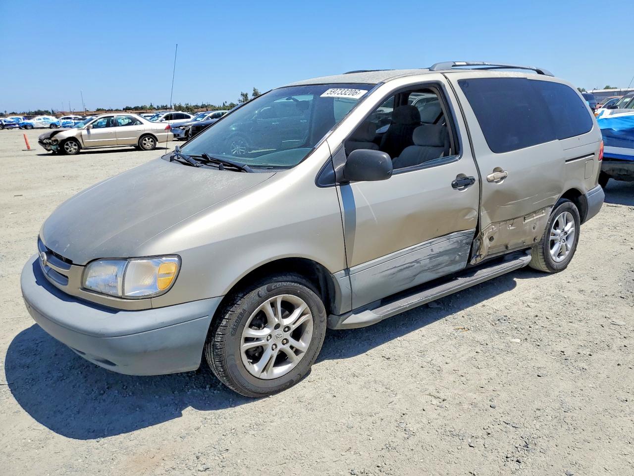 2000 Toyota Sienna LE, VIN 4T3ZF13C1YU230722 — Side