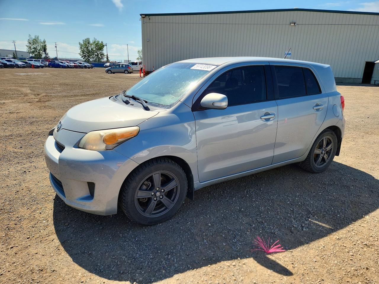 2013 Scion xD, VIN JTKKUPB47D1036962 — Side