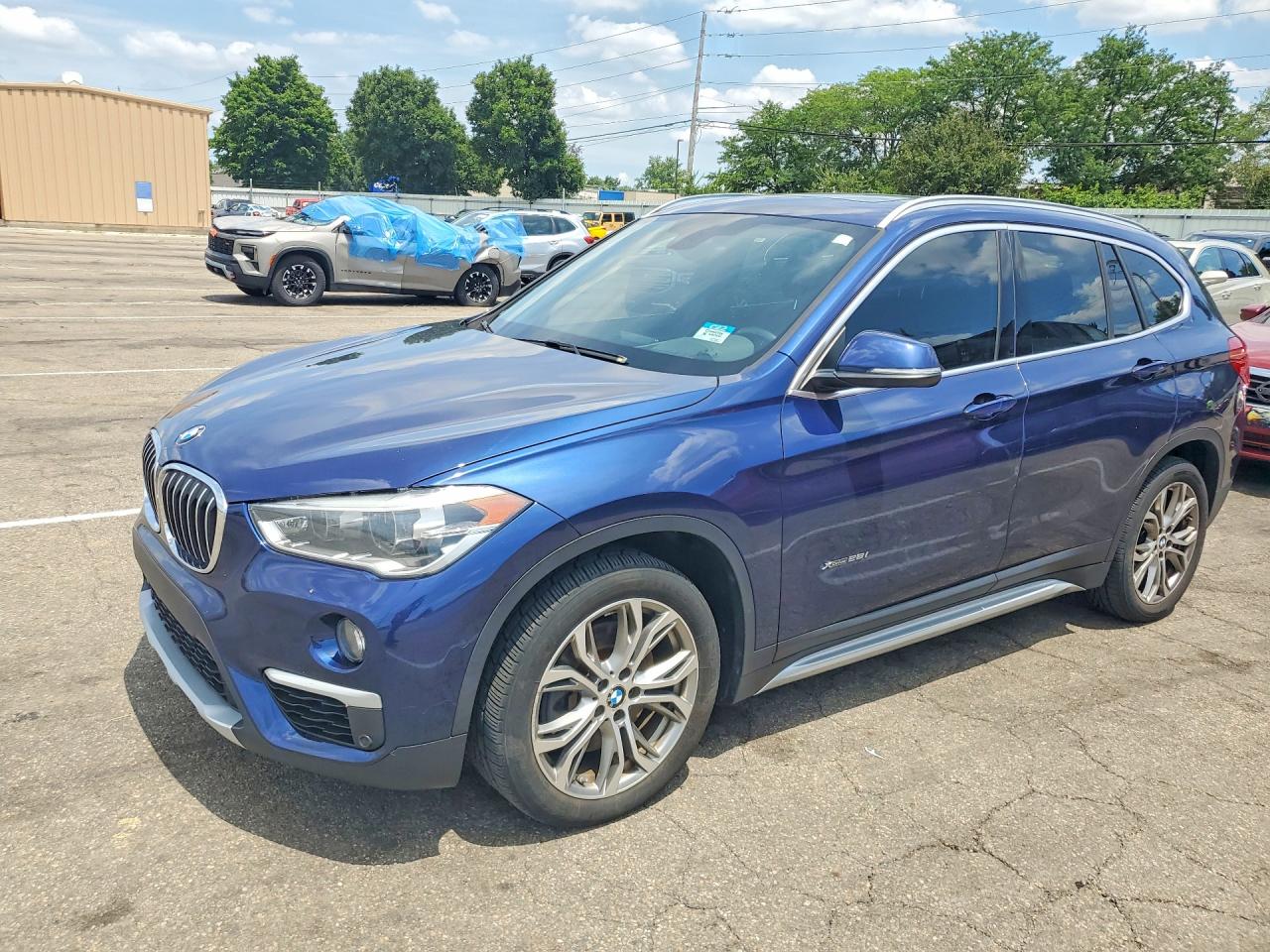 2017 BMW X1 xDrive28i, VIN WBXHT3C31H5F86620 — Water / flood