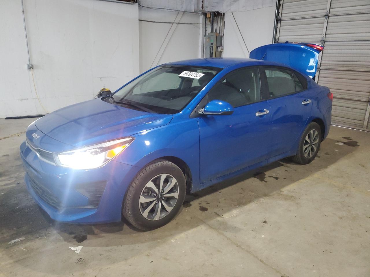 2023 Kia Rio LX, VIN 3KPA24AD9PE552637 — Rear end
