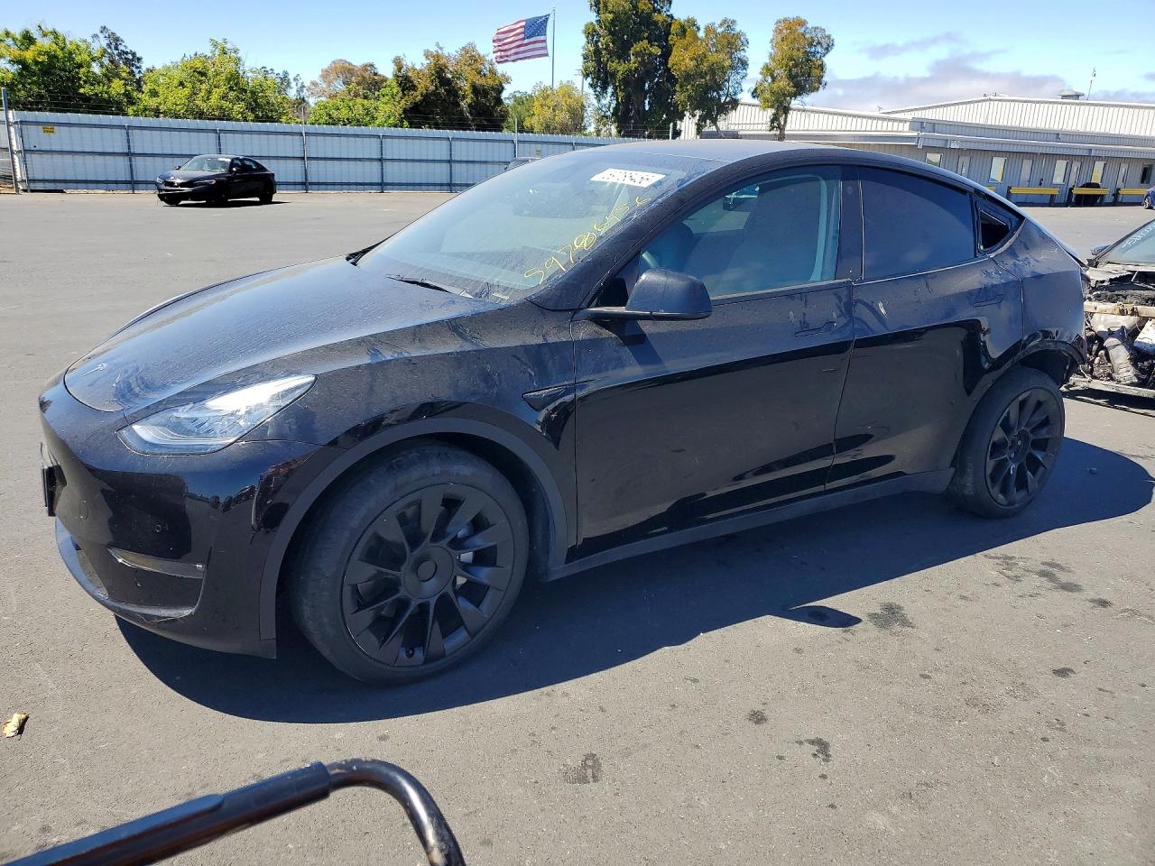 2023 Tesla Model Y Long Range, VIN 7SAYGDEE8PF586519 — Rear end