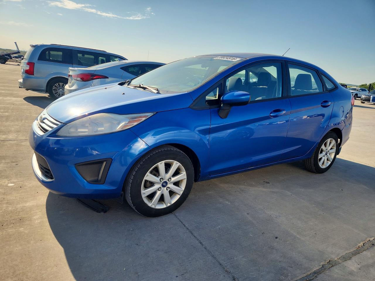 2011 Ford Fiesta SE, VIN 3FADP4BJ6BM193478 — Side