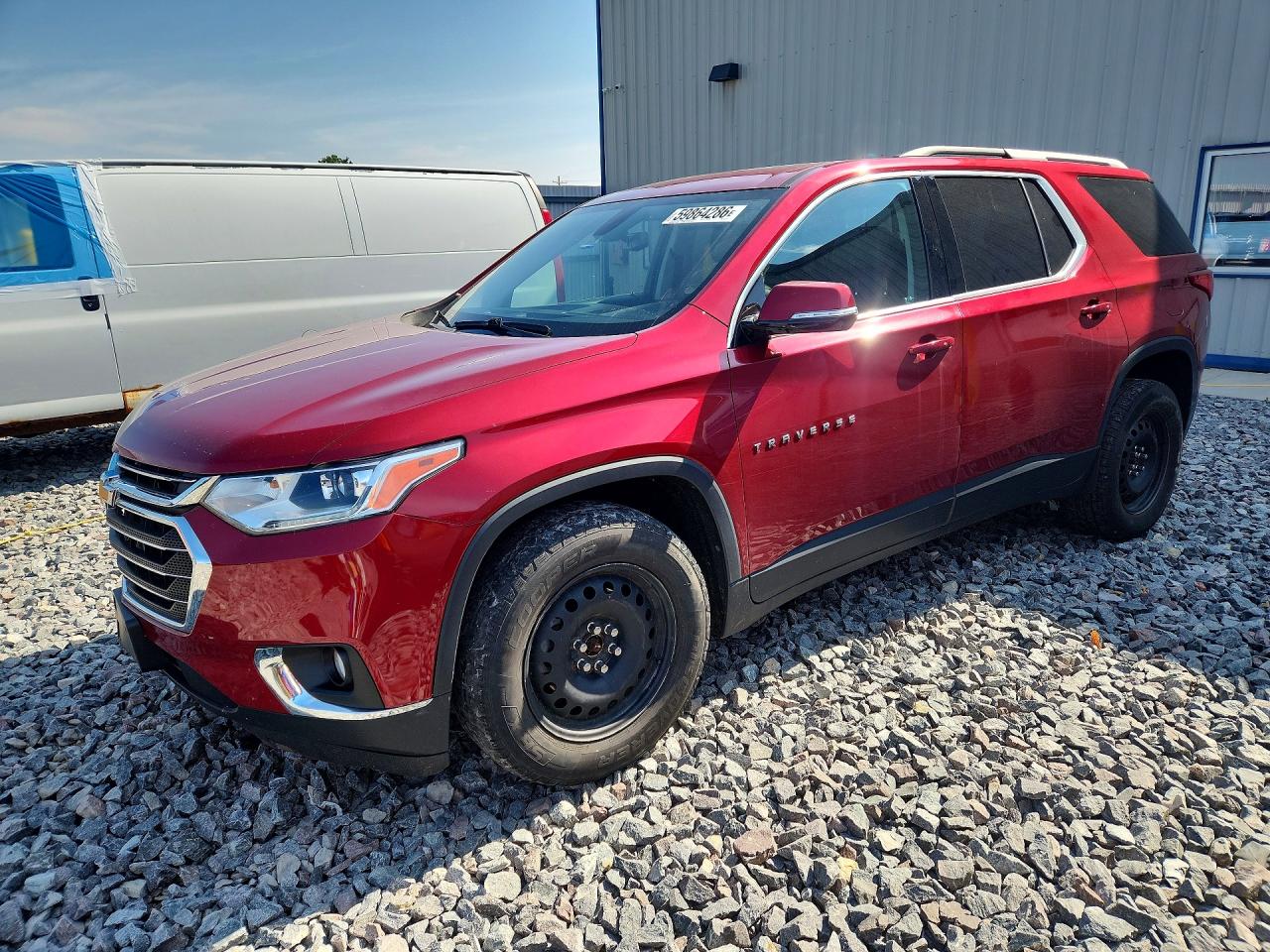 2018 Chevrolet Traverse LT, VIN 1GNEVHKW0JJ128877 — Hail