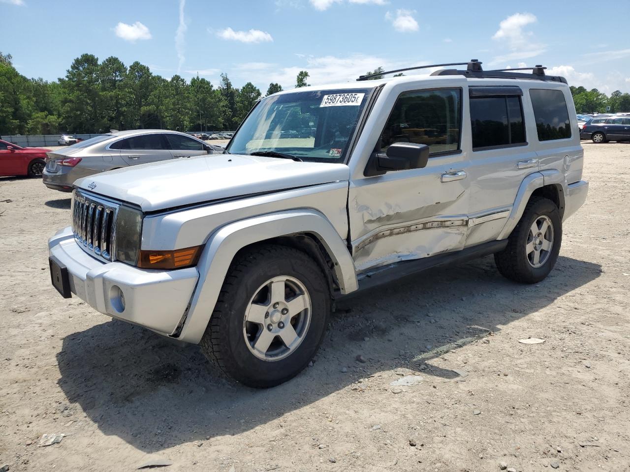 2010 Jeep Commander Sport, VIN 1J4RG4GK5AC121781 — Side