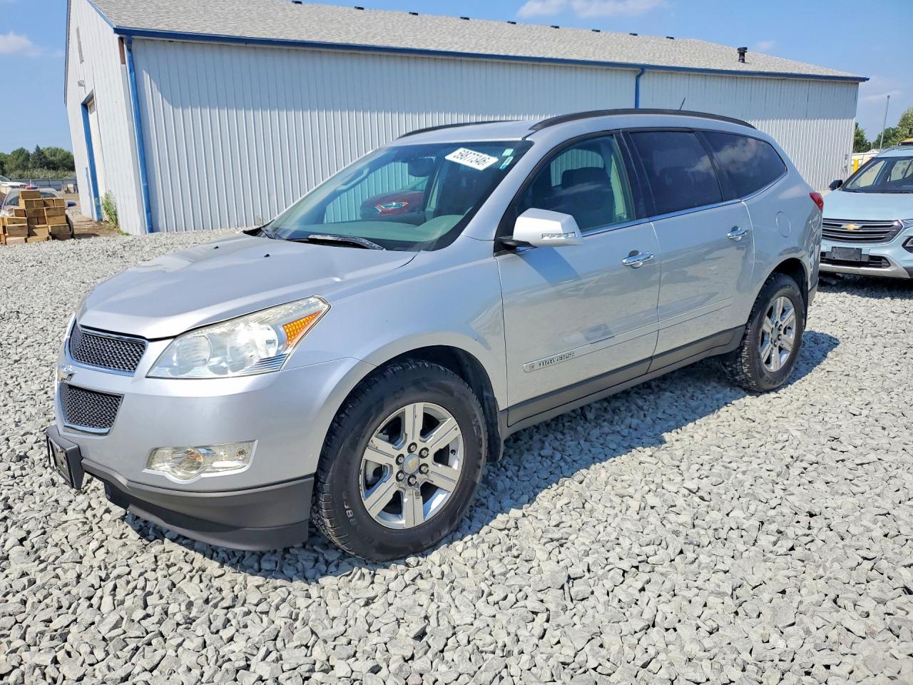 2009 Chevrolet Traverse 1LT, VIN 1GNER23D59S112713 — Side