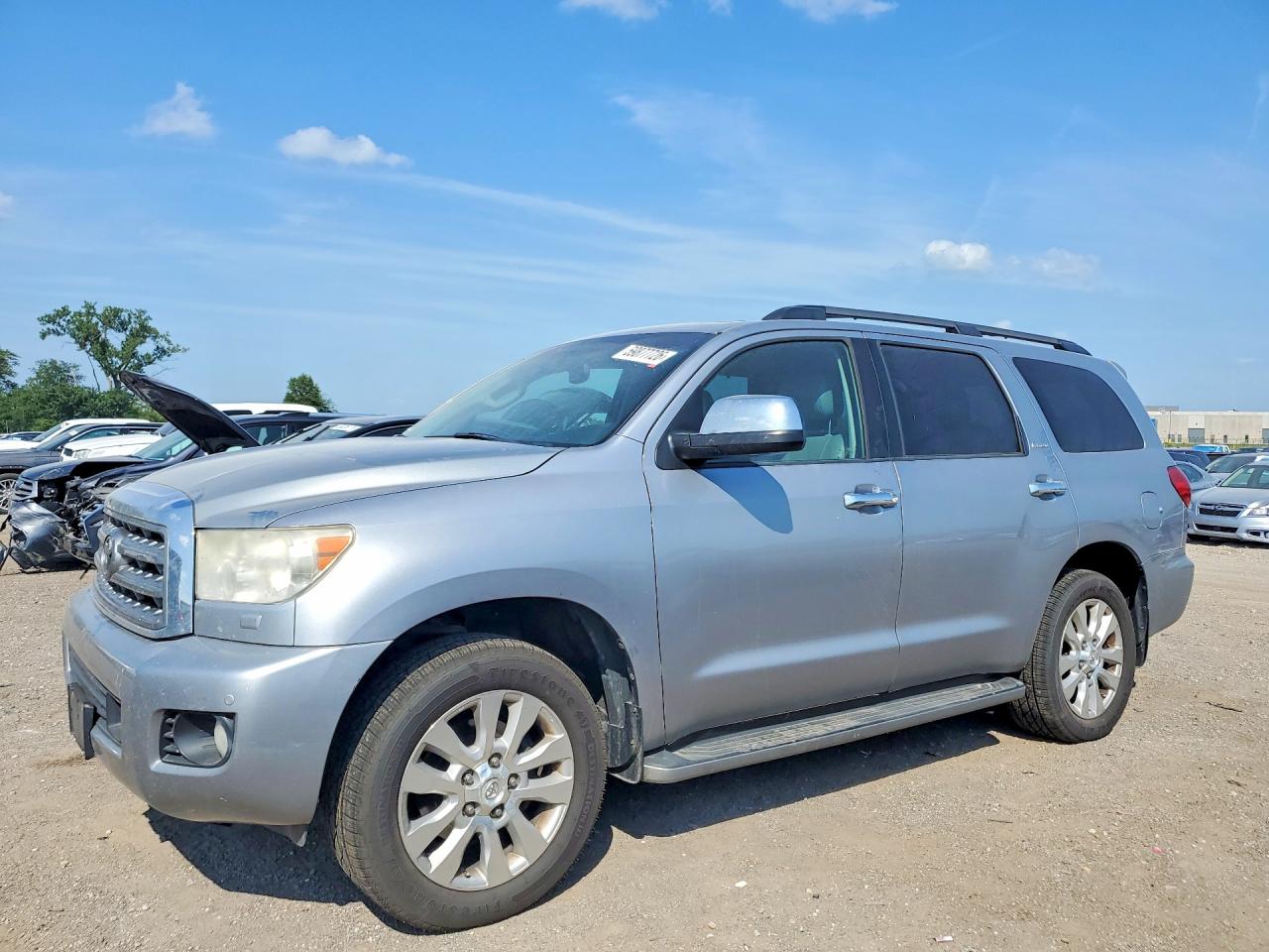 2012 Toyota Sequoia Platinum, VIN 5TDDW5G17CS058040 — Бок