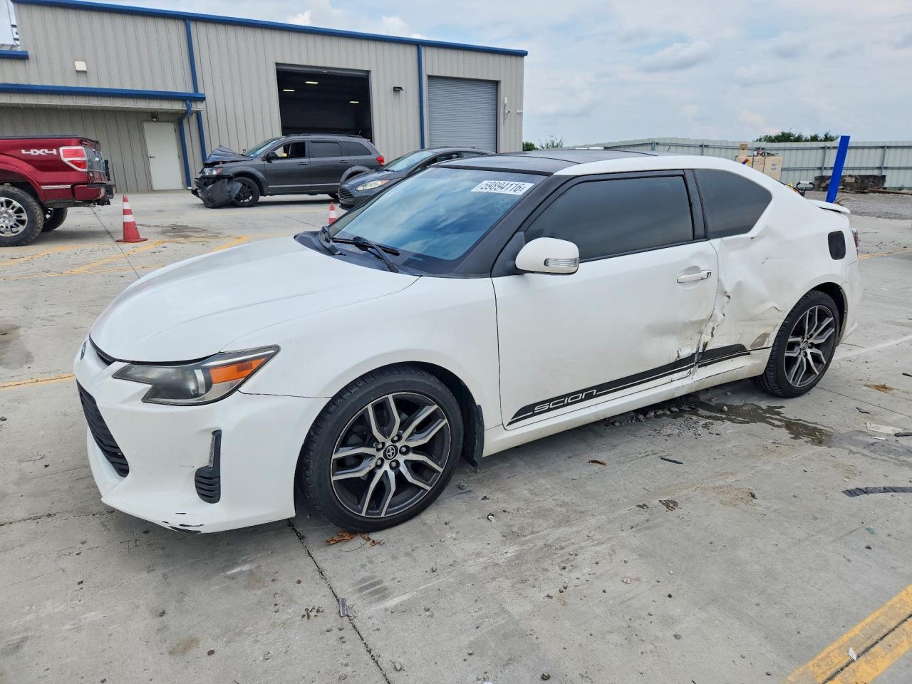 2014 Scion tC, VIN JTKJF5C78E3087105 — Side