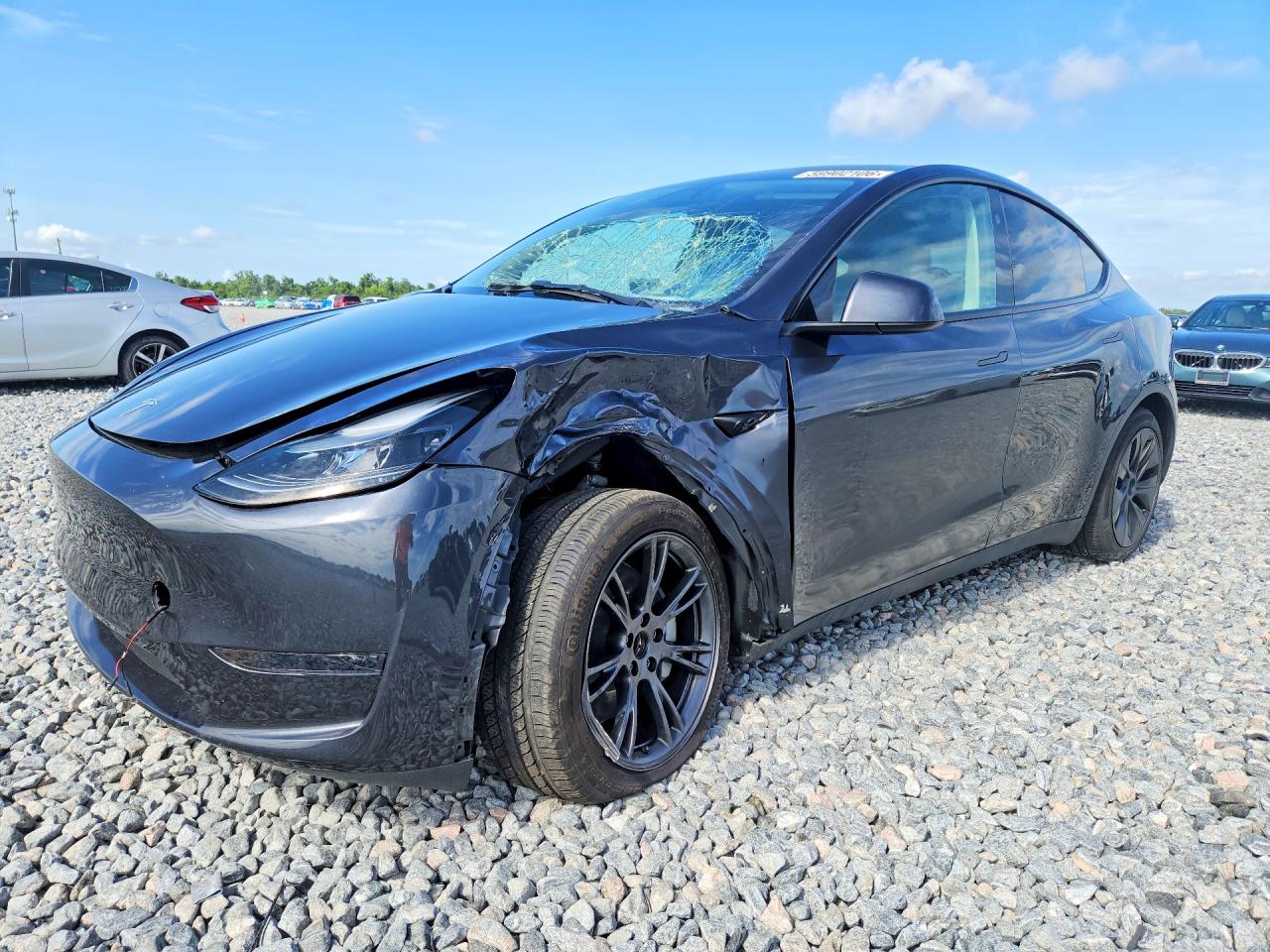 2025 Tesla Model Y Long Range, VIN 7SAYGDED5SF258877 — Front end
