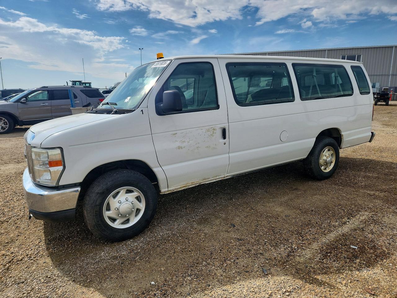 2011 Ford Econoline Passenger XLT, VIN 1FBSS3BL0BDB06444 — Side