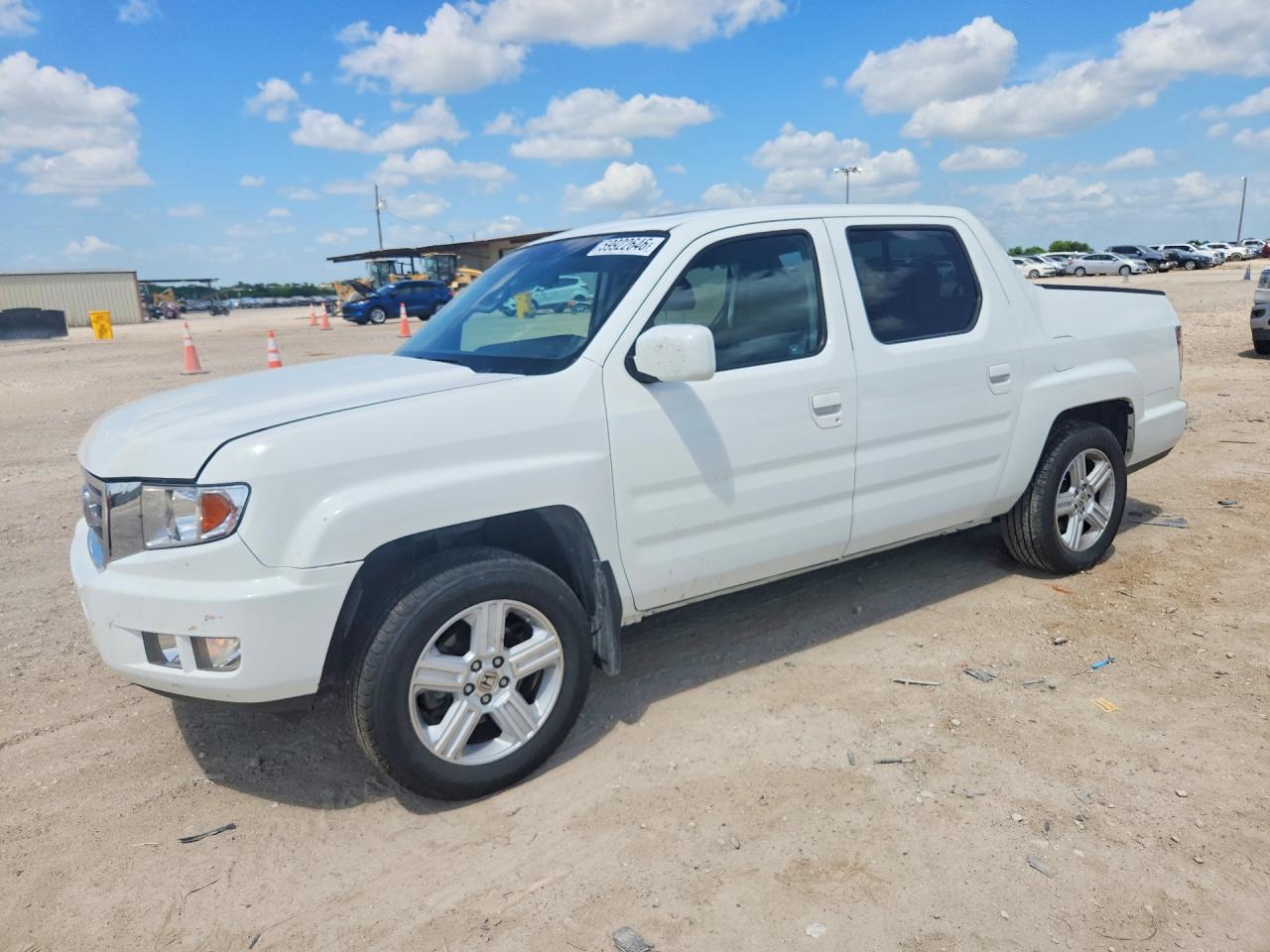 2012 Honda Ridgeline RTL, VIN 5FPYK1F53CB458621 — Side