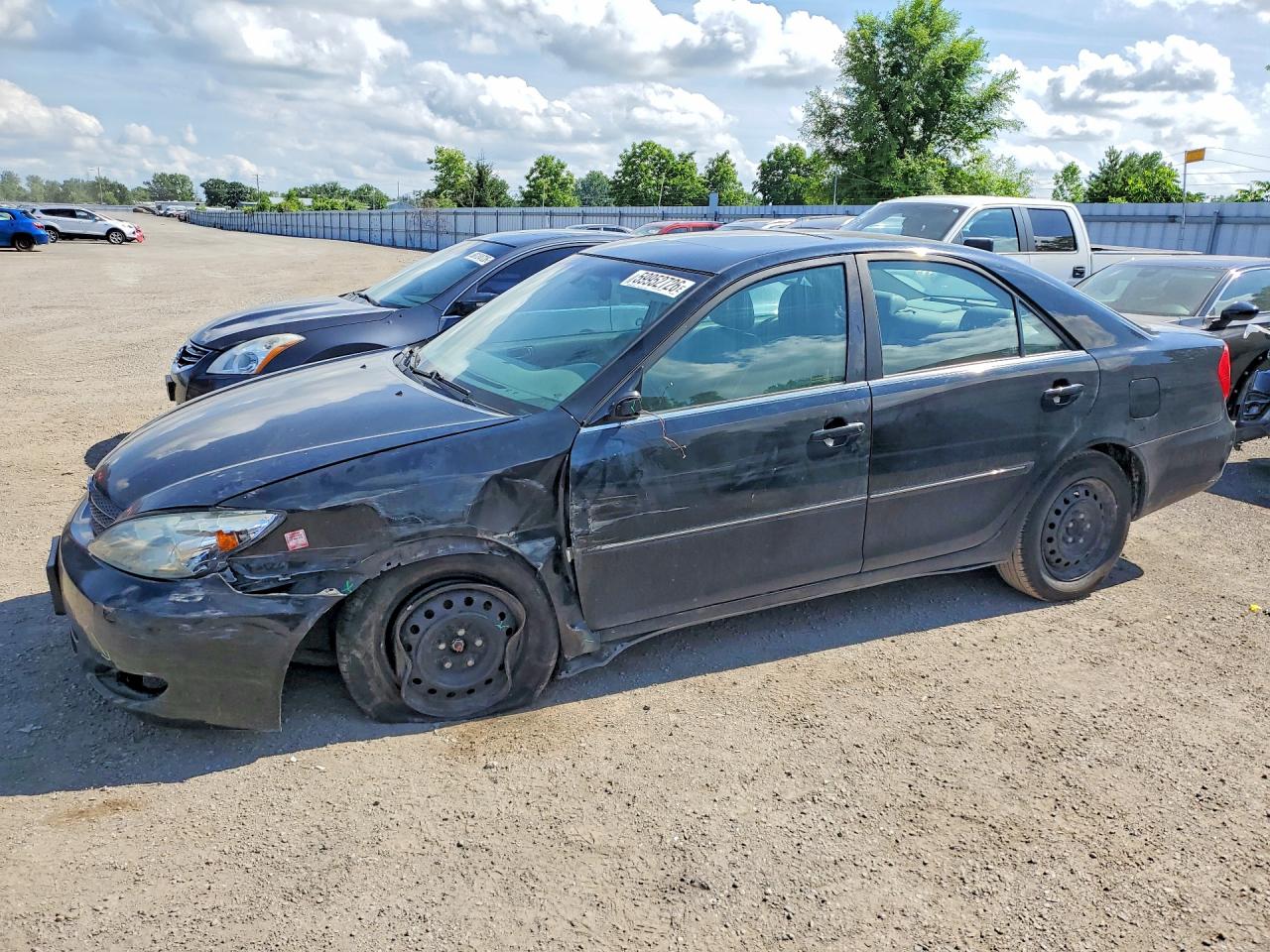 2002 Toyota Camry XLE, VIN JTDBF30K720030383 — Undercarriage