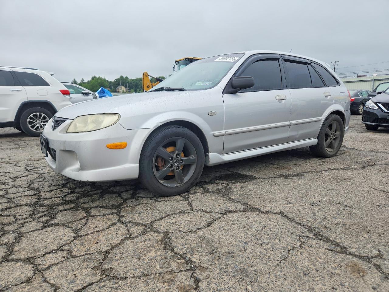 2003 Mazda Protege, VIN JM1BJ245631173687 — Бок