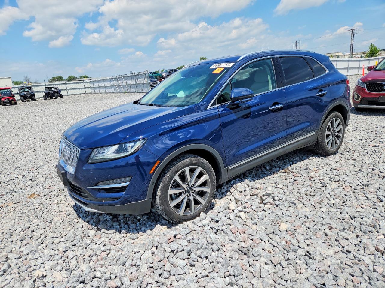 2019 Lincoln MKC Reserve, VIN 5LMCJ3D91KUL02387 — Side