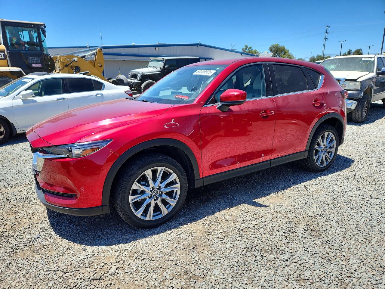 2021 Mazda CX-5 Grand Touring, VIN JM3KFADM4M1382129 — Rear end